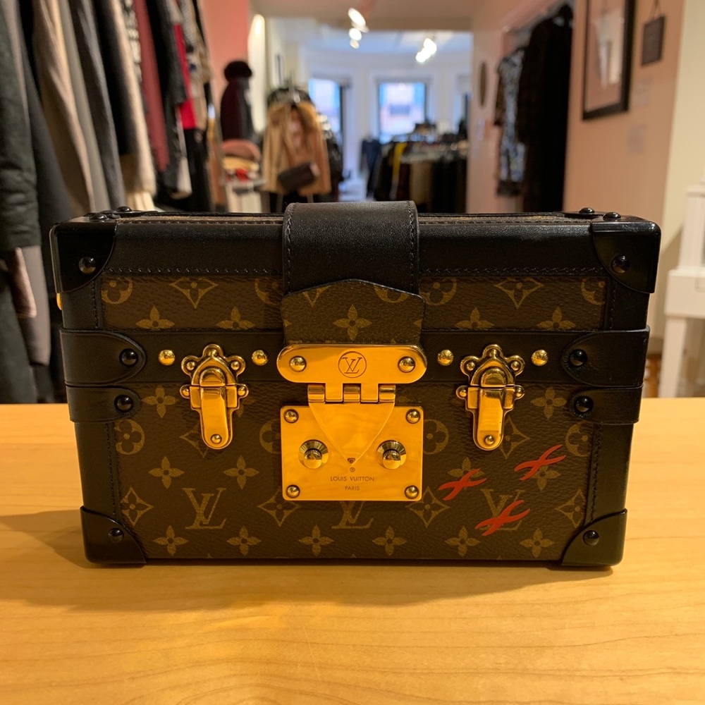 Louis Vuitton Petit Malle or “Little Trunk.”